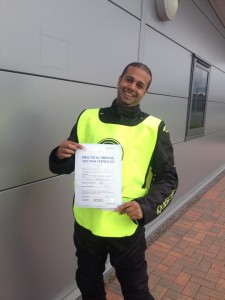 Omar with a huge smile after passing his mod-2 bike test FIRST TIME!