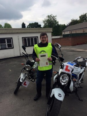 Rob proudly displays his certificate after passing both his motorcycle tests first time!