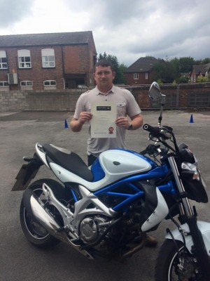 John proudly shows off his Inner Circle DAS course completion certificate after getting his full bike licence!