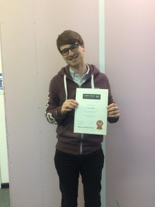 James proudly displays his DAS course completion certificate after passing his motorcycle test!